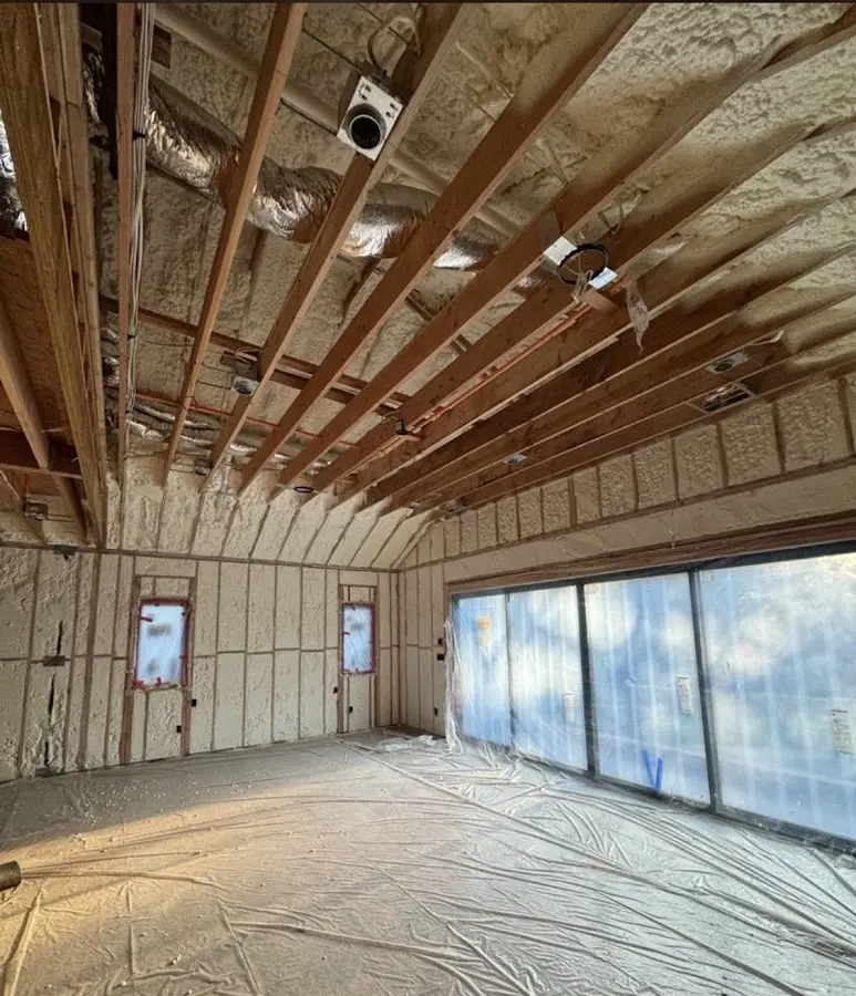 Interior walls and ceiling insulated with spray foam during new construction in Grenada